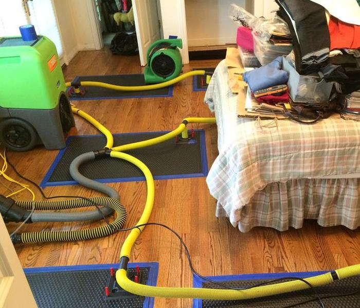 Image shows all the clean and green drying equipment saving Hardwood Floors