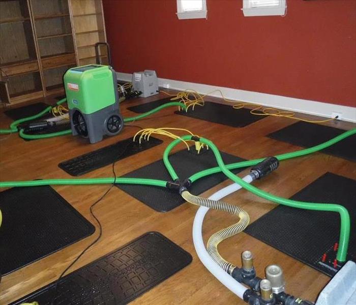 Showing the Hardwood Floor Drying System in progress